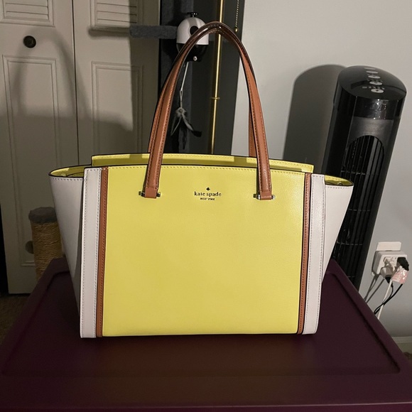 Kate Spade handbag yellow with white on the sides and brown straps